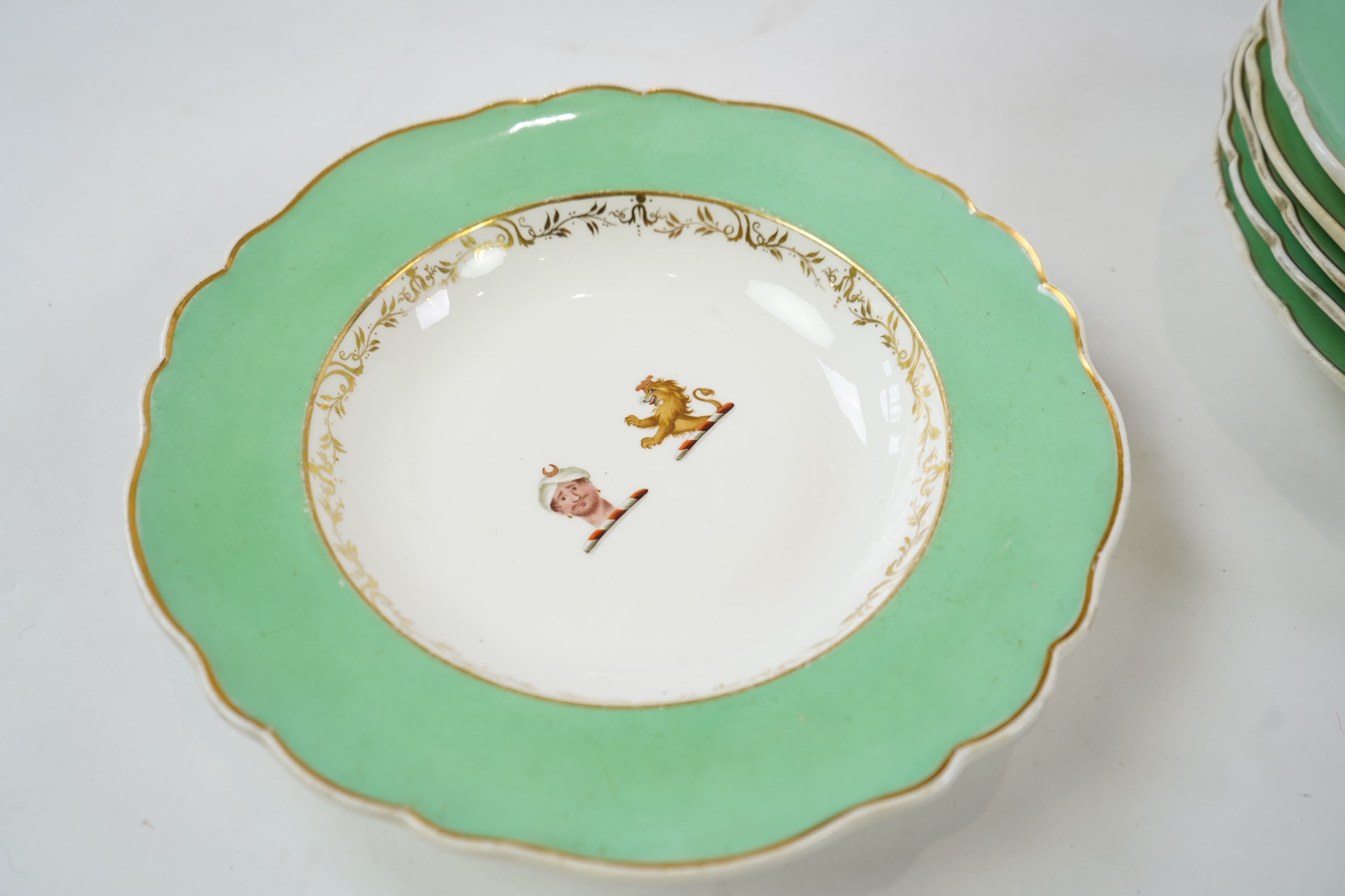 An English porcelain Turks head crested part dinner service, c.1830